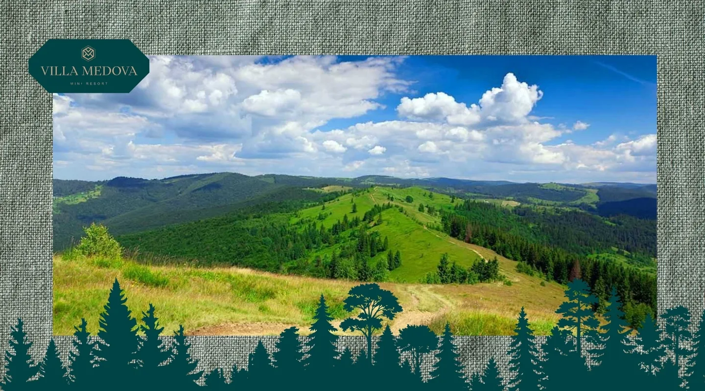 Hora Makivka marshrut, istoriya ta shcho podyvytysya poruch Panoramic view of rolling green hills and forests under a blue sky with white clouds; Villa Medova logo sits in the top-left corner.