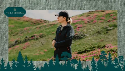 Woman outdoors in a hillside with pink flowers, wearing a black jacket and cap; Villa Medova branding in the top-left corner.