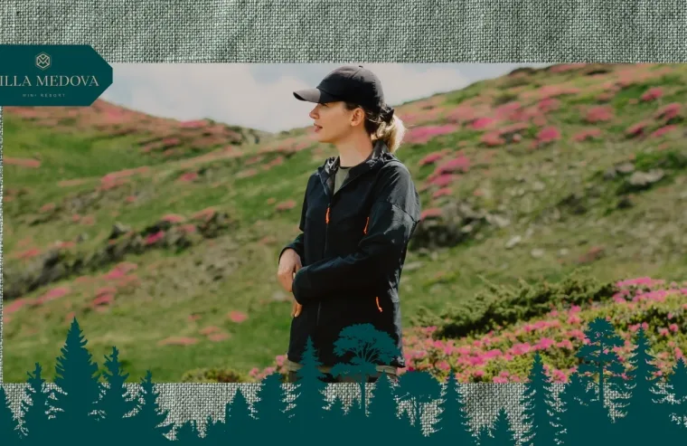 Vidpochynok u Karpatakh povnyy hayd po lokatsiyakh, sezonakh i tsinakh Woman outdoors in a hillside with pink flowers, wearing a black jacket and cap; Villa Medova branding in the top-left corner.