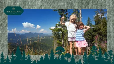 Two girls pose proudly with flexed arms on a mountain overlook, with trees and a blue sky behind; Villa Medova logo in the top-left corner.
