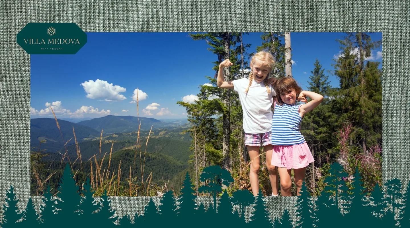 Vidpochynok z ditmy v Karpatakh kudy poyikhaty i chym zaynyaty malechu Two girls pose proudly with flexed arms on a mountain overlook, with trees and a blue sky behind; Villa Medova logo in the top-left corner.
